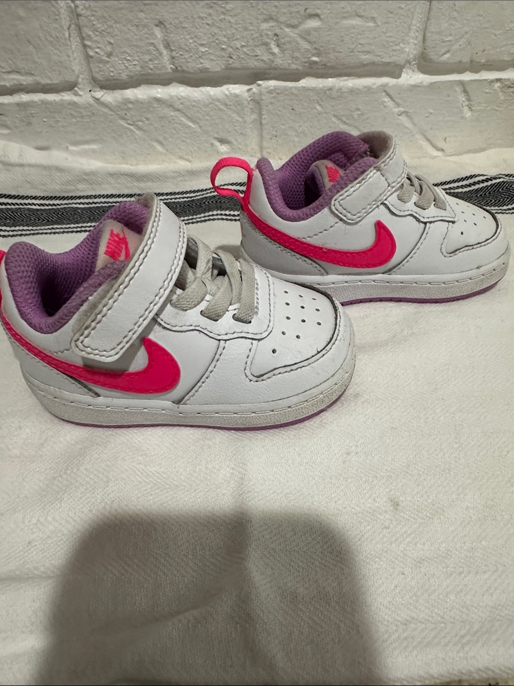 Nike Kids White Sneakers with Hot Pink Swoosh and Purple Lining